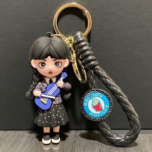Wednesday Addams with her violin keychain